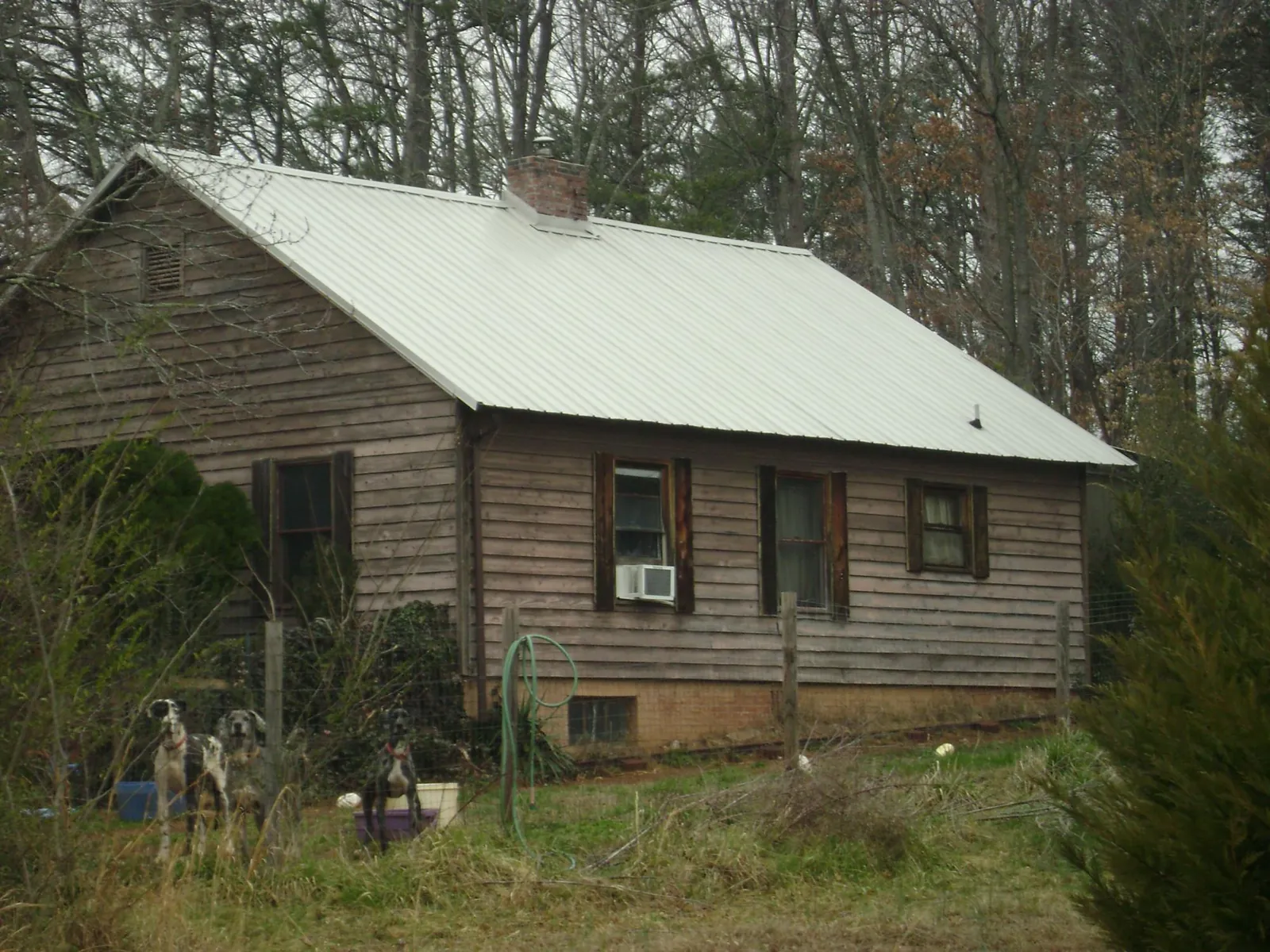 White metal roof on an old wood sided farmhouse, from a Metal Roof Installation job in South Lancaster